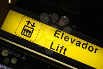 Royalty Free Photo of an Elevator Sign at an International Airport