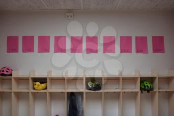 Pink name signs by students lockers at a school