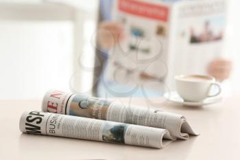 Morning newspapers on white table�