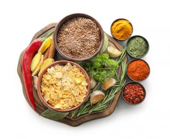 Bowls with various spices on white background�