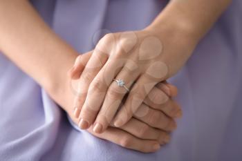 Young woman with engagement ring on her finger, closeup�