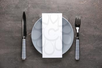 Blank menu with tableware on grey table�