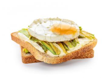 Tasty toasted bread with avocado and fried egg on white background�