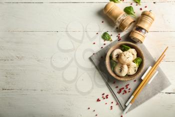 Composition with tasty Chinese dumplings on table�
