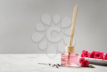 Rose reed diffuser on table�