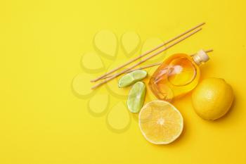 Citrus reed diffuser on color background�