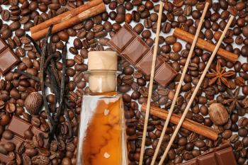 Reed diffuser, chocolate and cinnamon on coffee beans�