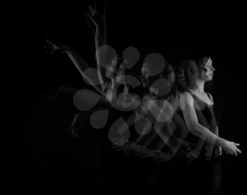 Stroboscopic photo of beautiful moving young woman on dark background�