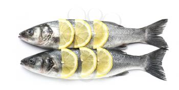 Tasty fresh seabass fish with lemon on white background�