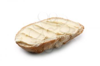 Slice of bread with butter on white background�
