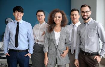 Team of young business people in office�
