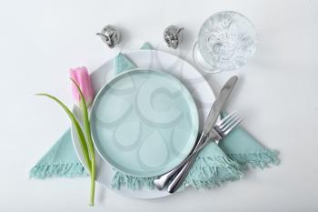 Beautiful Easter table setting on white background�