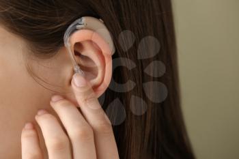 Woman with hearing aid, closeup�