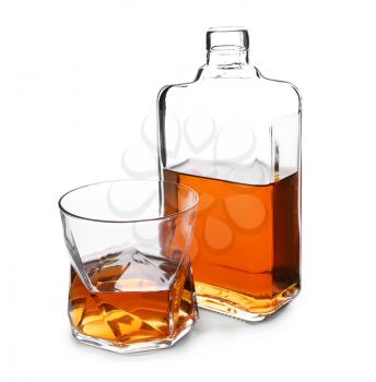 Bottle and glass of whiskey on white background�
