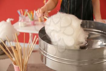 Woman making cotton candy at fair�