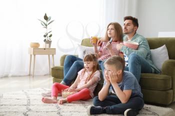 Family watching TV at home�