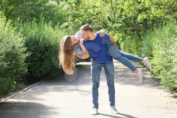 Happy young couple in park on summer day�