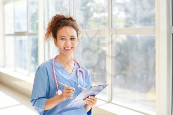 Young African-American nurse in clinic�