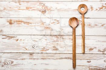 Wooden utensils on white table�
