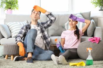 Tired young couple after cleaning flat�