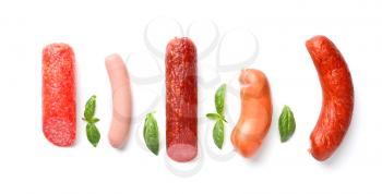 Assortment of sausages on white background�
