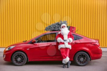 Santa Claus near car outdoors�