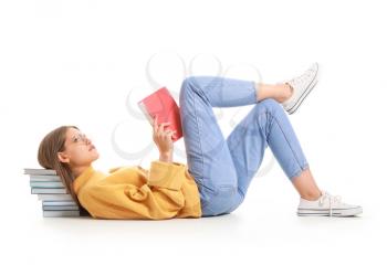 Beautiful young woman with books on white background�