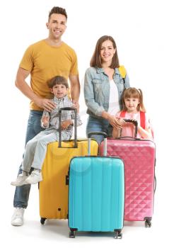 Happy family with suitcases isolated on white�