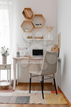 Comfortable workplace with mood board at home�