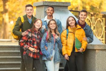 Group of teenage students outdoors�