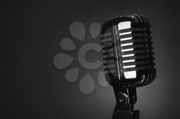 Retro microphone on dark background�