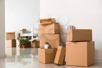 Cardboard boxes with belongings in new flat on moving day�