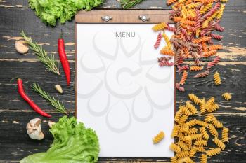 Blank menu and products on wooden background�