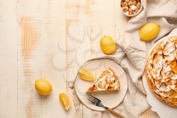 Tasty lemon pie on wooden table�