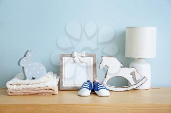 Baby accessories on table in room�