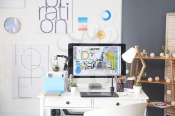 Comfortable workplace of interior designer in office�