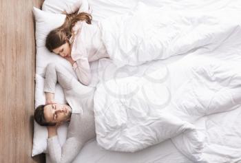 Young couple sleeping in bed�