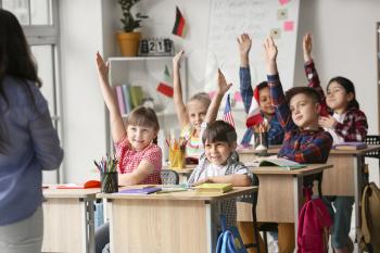 Little children during lesson at language school�