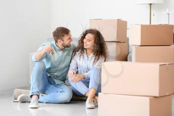 Happy young couple in their new flat on moving day�