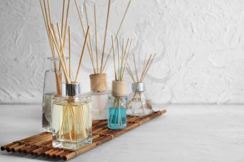 Different reed diffusers on table in room�