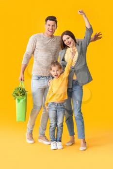 Happy family with food in bag on color background�