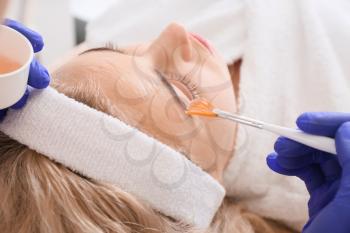 Woman undergoing procedure of carboxytherapy in beauty salon�