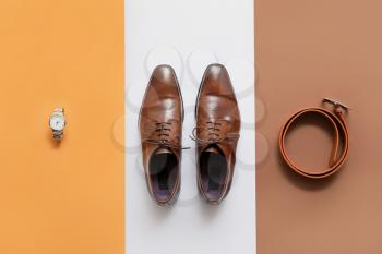 Classic leather male shoes on color background�