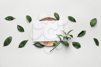 Composition with blank card and plate on white background�