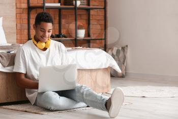 African-American student studying online at home�