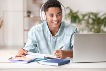 African-American student studying online at home�