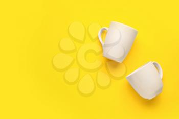Empty cups on color background�