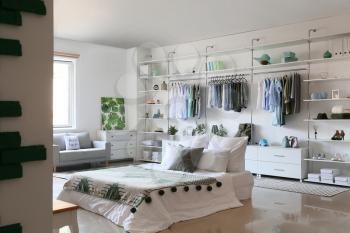 Interior of white modern bedroom with wardrobe�