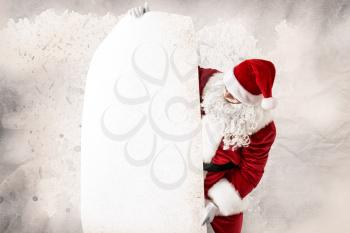Santa Claus with blank poster on light background�