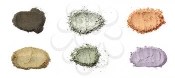 Different cosmetic clays on white background�